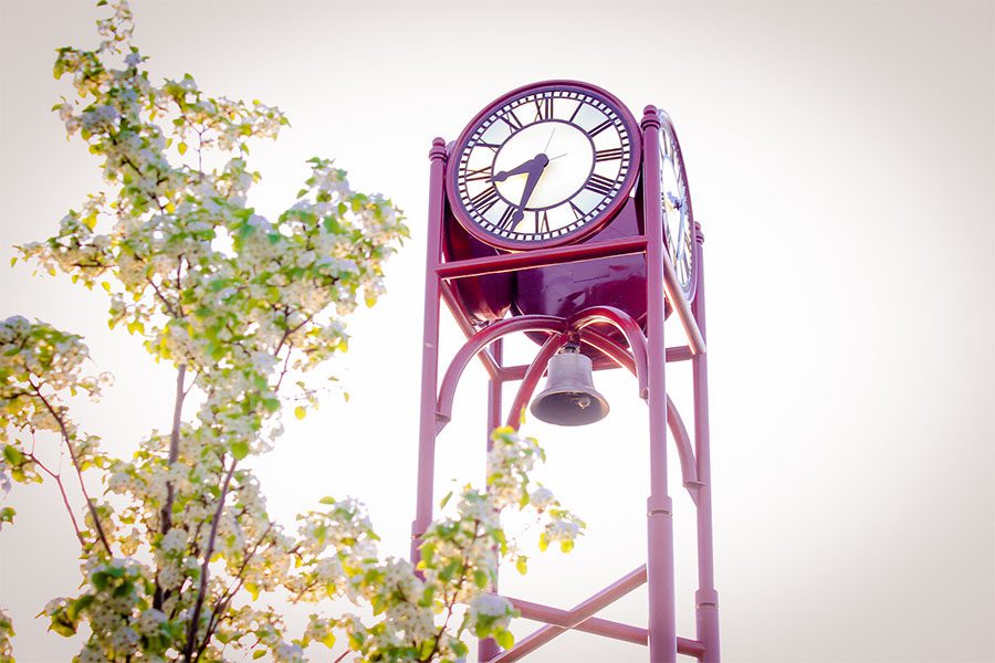 About Our Agency - Closeup View of the Petoskey Clock Tower on a Sunny Spring Day