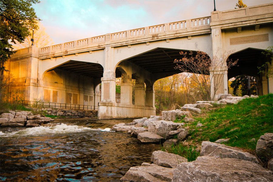 About Our Agency - View of a Bridge Across a River at Sunset in Petoskey Michigan
