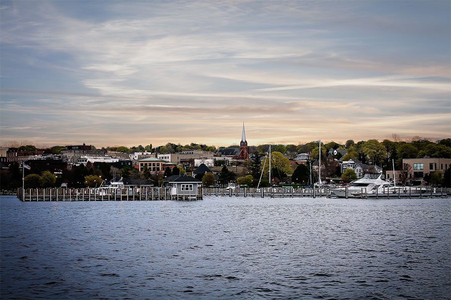 Contact - Scenic View of the Marina and Skyline of the City of Petoskey in Michigan on a Cloudy Day at Sunset