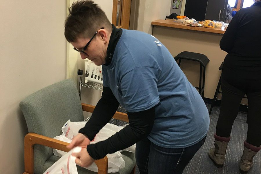 Our Culture - Harbor Brenn Insurance Employee Getting Ready to Pack Up Food with Plastic Bags