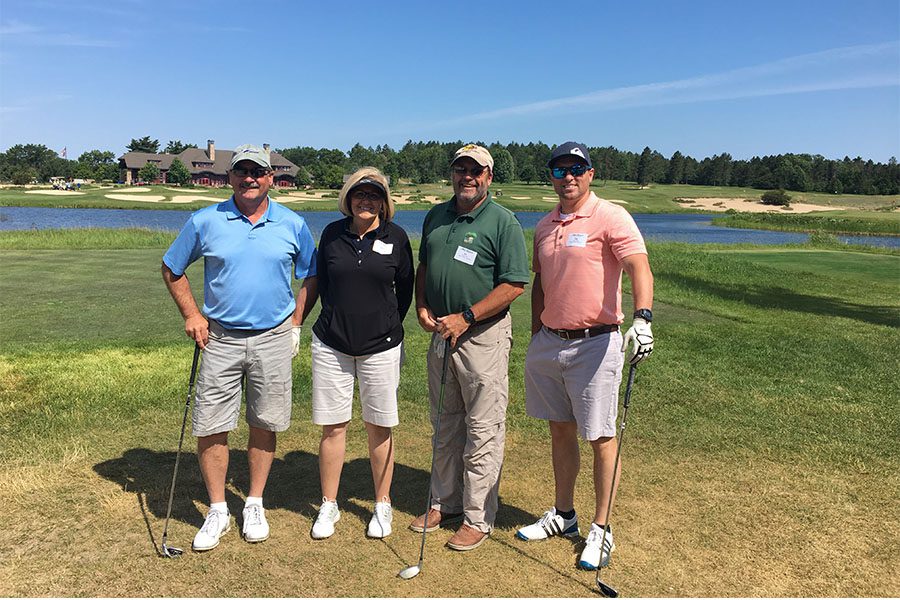 Our Culture - Harbor Brenn Insurance Employees Enjoying Golf on a Sunny Day