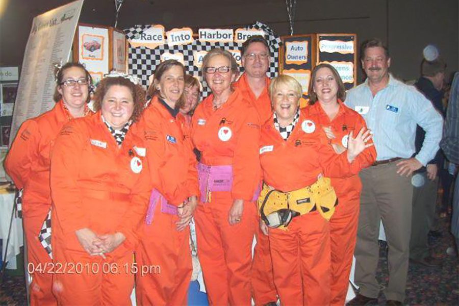 Our Culture - Harbor Brenn Insurance Staff Portrait Wearing Car Racing Gear