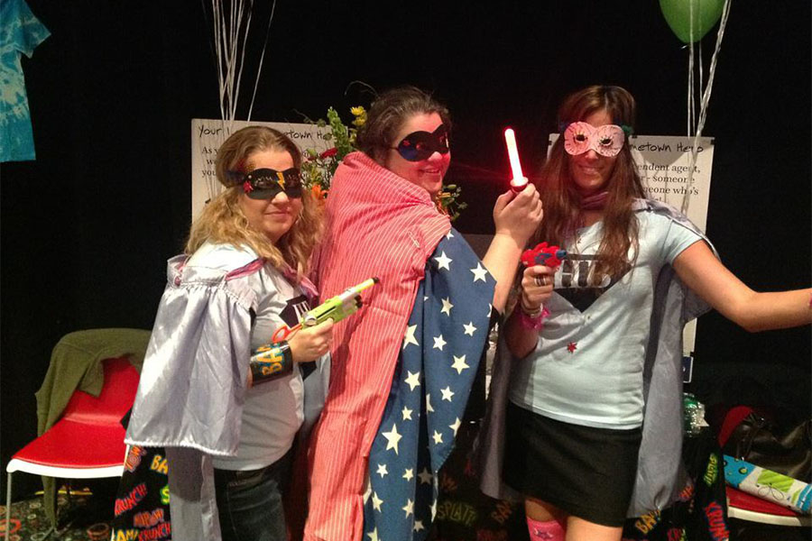 Our Culture - Three Harbor Brenn Insurance Employees Wearing Super Hero Capes and Costumes at Hometown Heroes Event