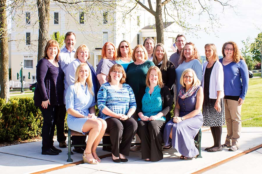 Personal Insurance - Portrait of the Harbor Brenn Insurance Agencies Staff Outside in a Park on a Sunny Day